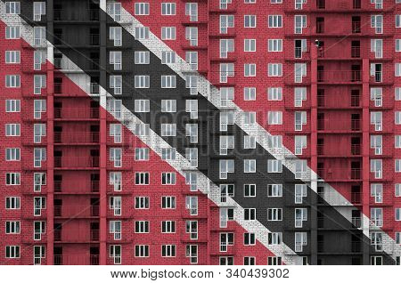 Trinidad And Tobago Flag Depicted In Paint Colors On Multi-storey Residental Building Under Construc