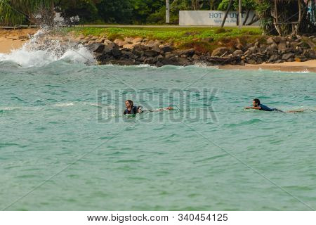 Midigama, Sri Lanka : 2019 Nov 18 :  People Surfing The Beach Whit Golden Sand In Midigama, Sri Lank