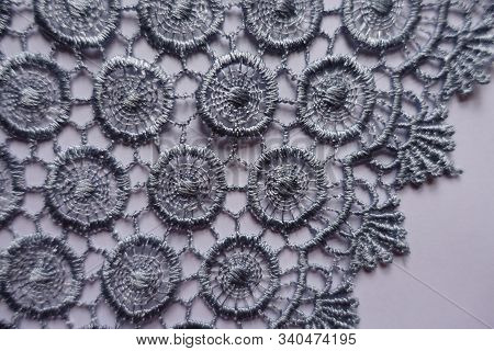 Closeup Of Edge Of Grey Lace With Circular Pattern