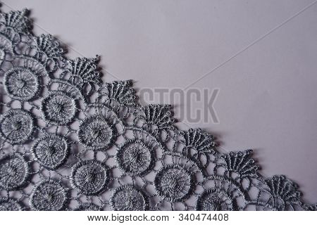 Diagonal Edge Of Silver Lace Fabric From Above