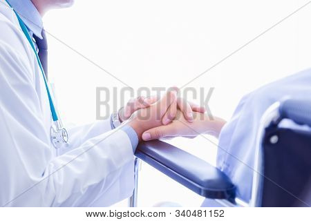 Doctor Visit Patient, Talking, Comforting, Consoling, Encouraging By Holding Patients Hand. Illness 