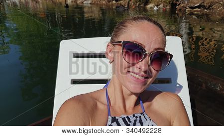 Woman Shooting Self Portrait. Take Photo And Video On Smartphone. Girl Rest, Relax, Walk In Sunglass
