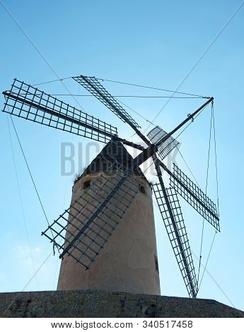 Windmill Backlight In Mallorca. Balearic Islands.nice Backlight View Of A Windmill, On The Blue Back