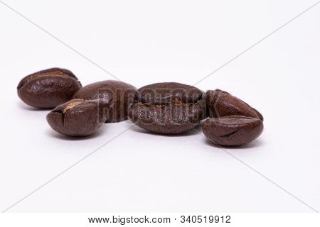 Close Up Of Coffee Beans On A White Background