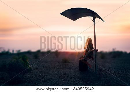 Zahedan, Baluchestan / Iran - Sep 12 2015 :alone Girl Sited In The Bench And Watching Sunset