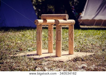A Figure Of Wooden Cylinders Is Installed. Game Towns. In The Camp