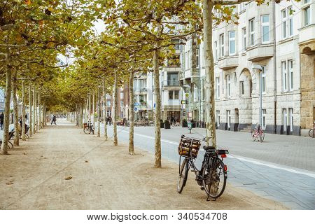 Bicycle Parked On City Street. A City Bike In Dusseldorf. Urban Bike Parked Without Anyone On Europe
