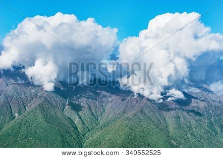 Caucasus Mountains And Clouds Above At Day Time. Sochi. Russia.
