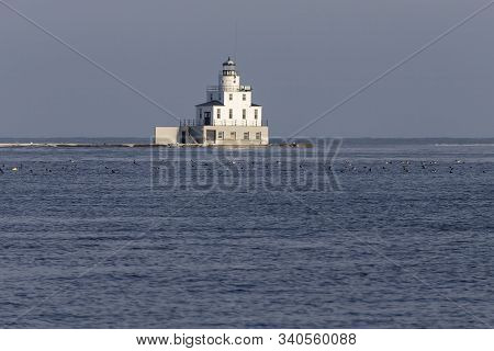 A Lighthouse At The Mouth Of The Manitowoc River Into Lake Michigan In  Wisconsin