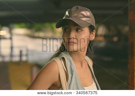 Young Beautiful Asian Tourist Woman Exploring The City Of Bangkok, Thailand