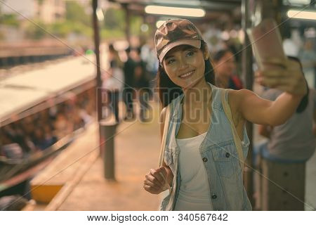 Young Beautiful Asian Tourist Woman Exploring The City Of Bangkok, Thailand