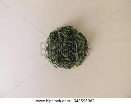 Dried Hedge Mustard On A Wooden Board