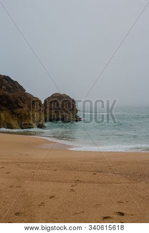 Sea And Sandy Beach In Dense Fog, Autumn Day