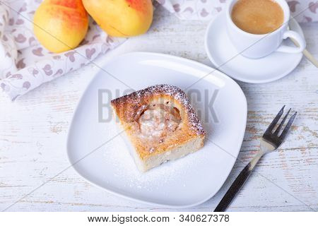 Mannik (semolina Pie) With Pear And Canella. In The Background Is A Cup Of Coffee And Fresh Pears. T