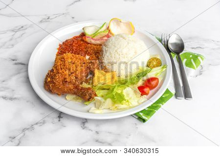 Ayam Penyet Is Indonesian East Javanese Cuisine - Consisting Of Fried Chicken That Is Smashed With T