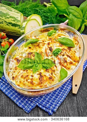 Zucchini Baked With Tomatoes In Pan On Napkin