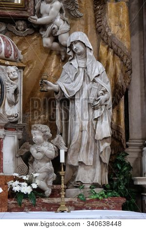 BUDVA, MONTENEGRO - JUNE 09, 2012: Saint Clare of Assisi, statue on the High Altar in the Catholic Church of the Saint Clare in Kotor, Montenegro