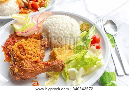 Ayam Penyet Is Indonesian East Javanese Cuisine - Consisting Of Fried Chicken That Is Smashed With T