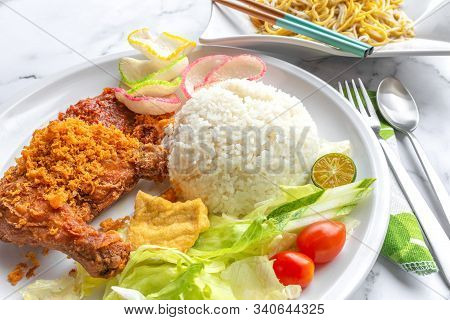 Ayam Penyet Is Indonesian East Javanese Cuisine - Consisting Of Fried Chicken That Is Smashed With T