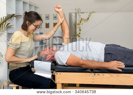 Man Having Chiropractic Back Adjustment. Physioterapy, Osteopathy, Alternative Medicine Pain Relief 