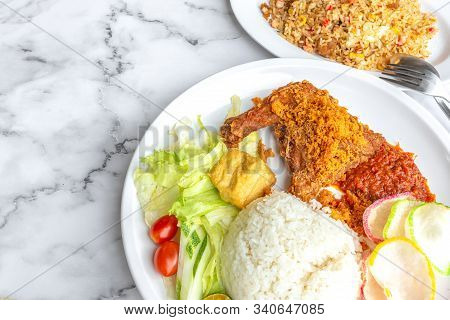 Ayam Penyet Is Indonesian East Javanese Cuisine - Consisting Of Fried Chicken That Is Smashed With T