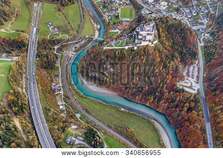 Aerial View Of Green Meadows With Villages And Forest In Austrian Alps Mountains.