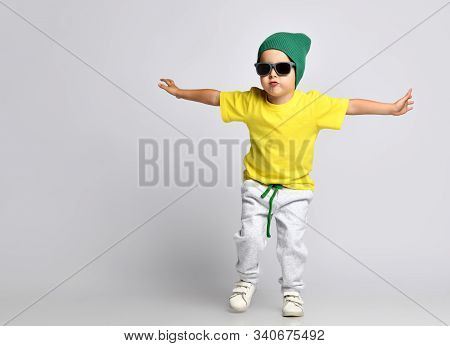 Cheerful Kid Hipster Boy With Hands Spread Up Laughing Smiling Onwhite Background