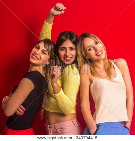 Stock Photo Of Three Young Women Together With A Funny Expression And The One In The Middle With Her