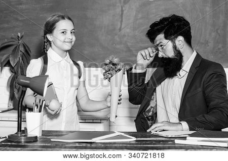 Gift. Small School Girl Kid With Flower Bouquet. Teachers Day. Daugghter And Father With Flowers. Fl