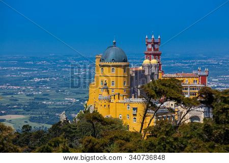 Sintra, Portugal - May, 2018: The Pena Palace Seen From The Gardens Of Pena Park At The Municipality