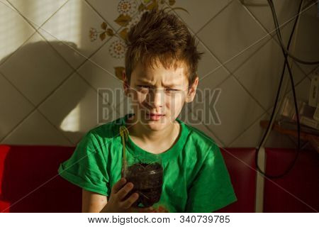 Boy with chickenpox grow plant from the seed. Chickenpox rash. Sprouted seed