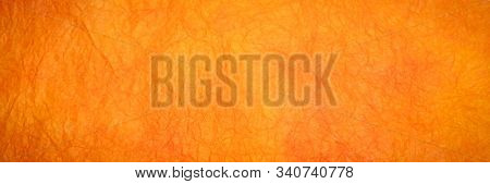 background of orange and red marbled momi paper, panoramic banner