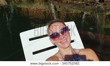 Woman Shooting Self Portrait. Take Photo And Video On Smartphone. Girl Rest, Relax, Walk In Sunglass