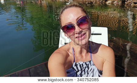 Woman Shooting Self Portrait. Take Photo And Video On Smartphone. Girl Rest, Relax, Walk In Sunglass