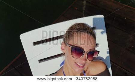 Woman Shooting Self Portrait. Take Photo And Video On Smartphone. Girl Rest, Relax, Walk In Sunglass