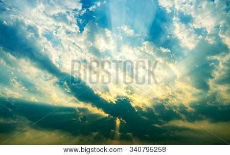 Sun Hiding In Clouds At Sunset