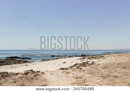 View On Robben Island Seen From The Sea Point Promenade In Cape Town, South Africa.