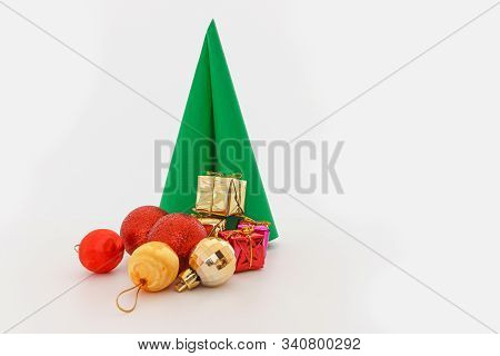 Paper Christmas Tree ,with  Ball And Gift,ornament On White Background,copy Space
