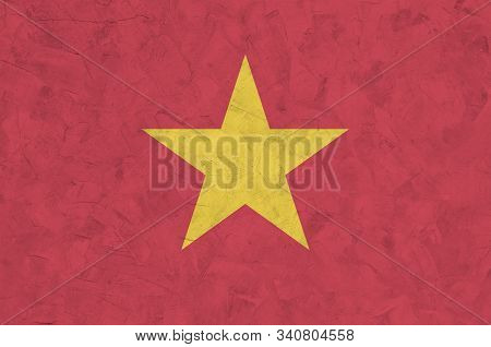 Vietnam Flag Depicted In Bright Paint Colors On Old Relief Plastering Wall. Textured Banner On Rough