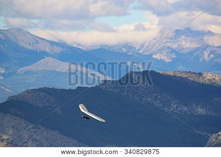 Hang Glider Flying From The Chabre Mountain, France