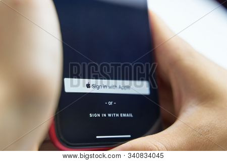 Bishkek, Kyrgyzstan - June 6, 2019: Sign In With Apple Button For Your Privacy. Man Holds A Smartpho