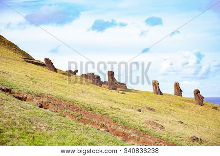 Moai On Ranu Raraku Volcan. Ester Island Landscape