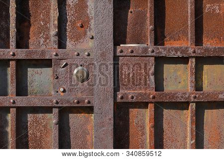Closeup Of Old Rusty Metal Lock And Keyhole On A Old Iron Door As A Beautiful Vintage Background. Fr