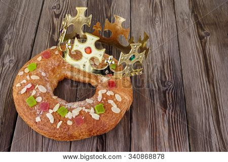 Epiphany Cake, Kings Cake, Roscon De Reyes Or Rosca De Reyes On Wooden Table