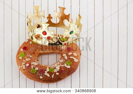 Epiphany Cake, Kings Cake, Roscon De Reyes Or Rosca De Reyes On Wooden Table