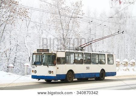 Ufa, Russia - January 13, 2010: Classic Soviet Trolleybus Ziu 682v At The Background Of A Snow Cover