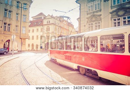 Typical Old Retro Vintage Tram On Tracks Near Tram Stop In The Streets Of Prague City In Lesser Town