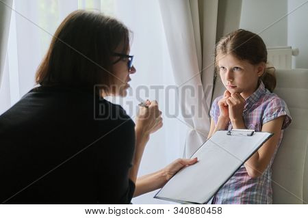 Meeting Child Girl With School Counselor Therapist. Children Mental Health, Psychological Assistance