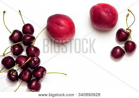 Juicy Nectarine And Ripe Sweet Cherries Isolated On White Background. Sliced Nectarine Closeup And R