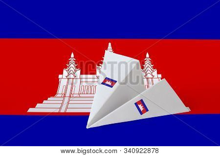 Cambodia Flag Depicted On Paper Origami Airplane. Handmade Arts Concept